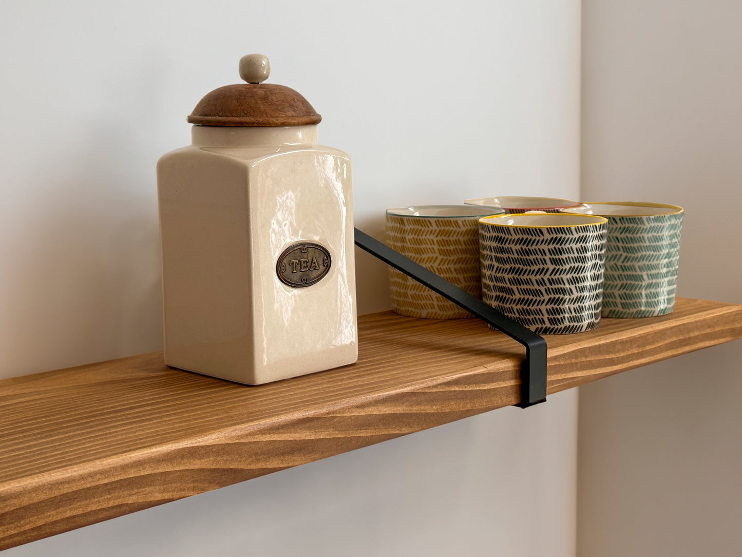 Wooden shelf on suspense bracket with Fiddes colour range