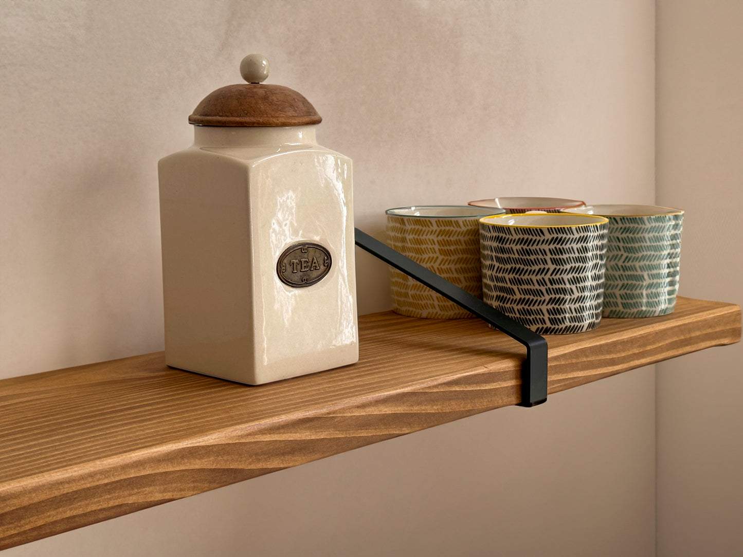 Wooden shelf on suspense bracket with Fiddes colour range