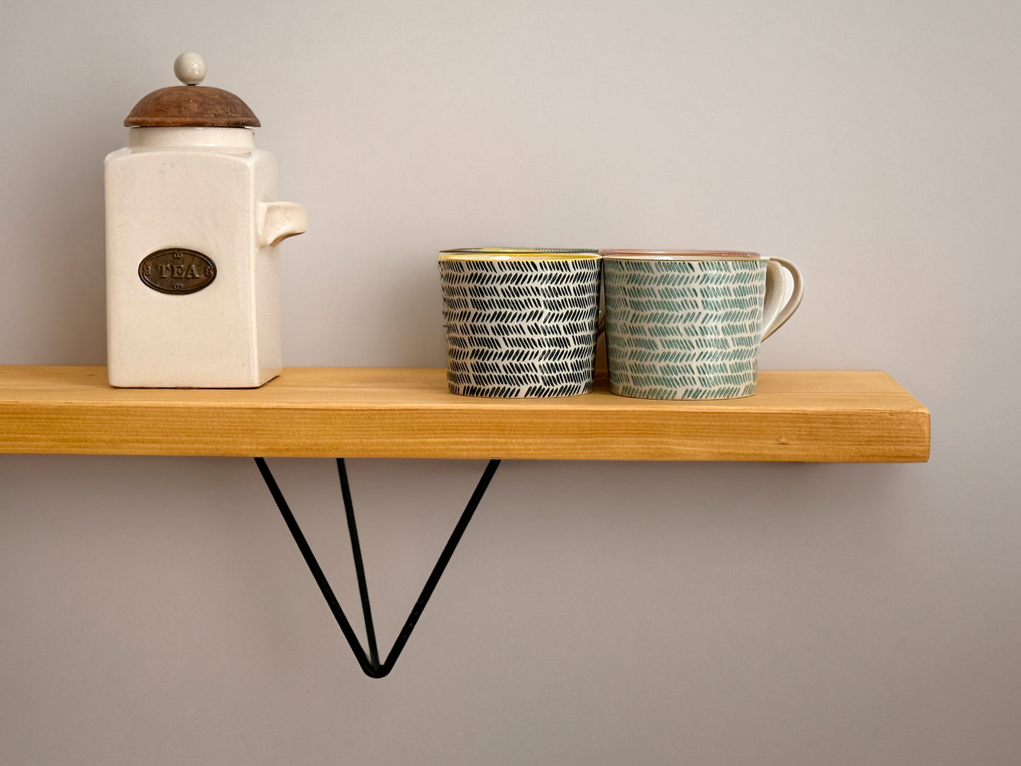 Wooden shelf on prism bracket with Fiddes colour range