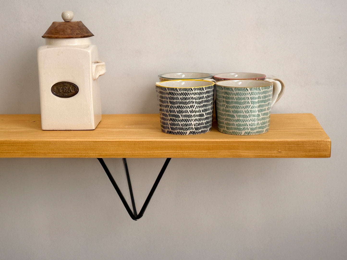 Wooden shelf on prism bracket with Fiddes colour range