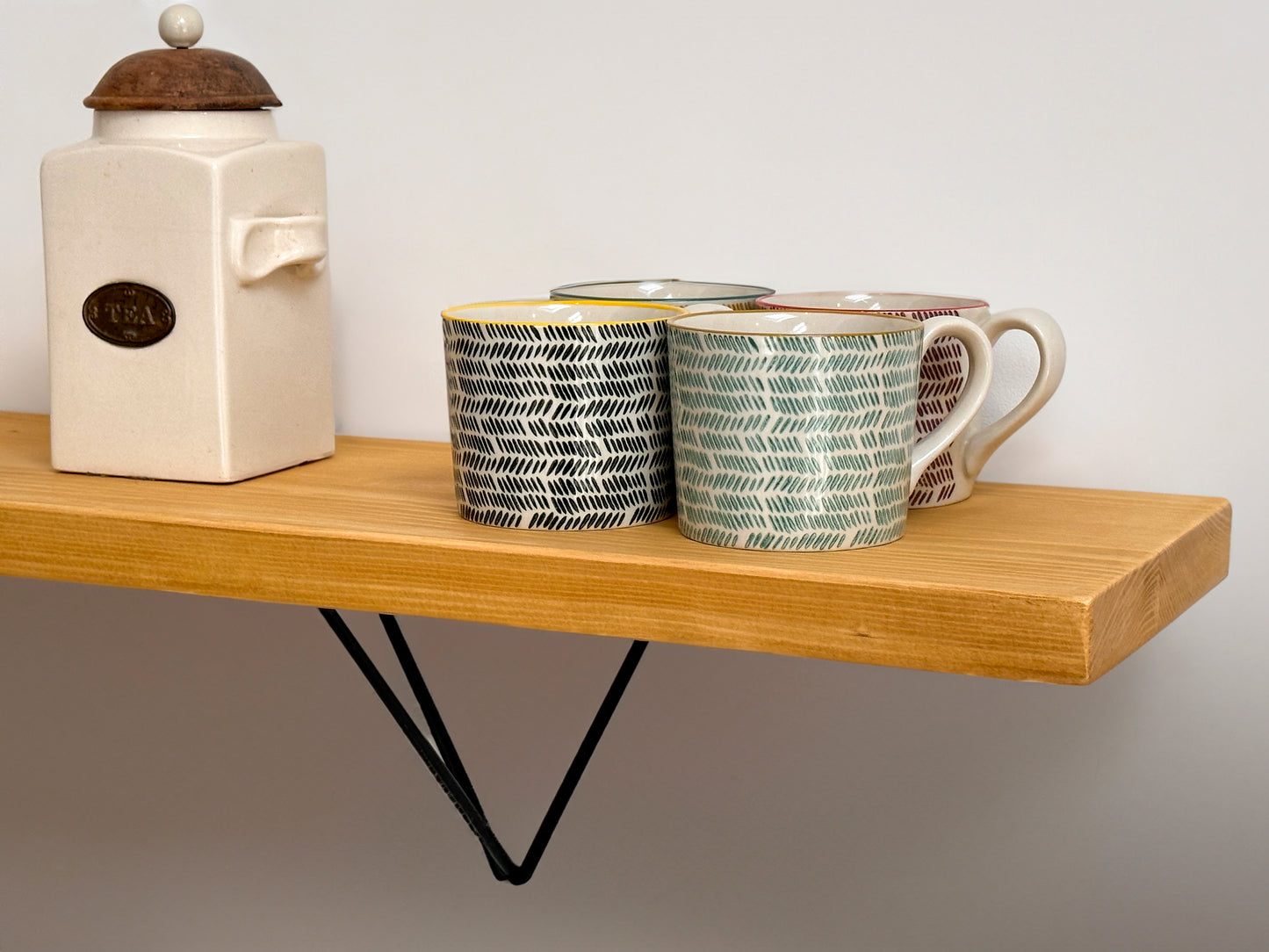 Wooden shelf on prism bracket with Fiddes colour range