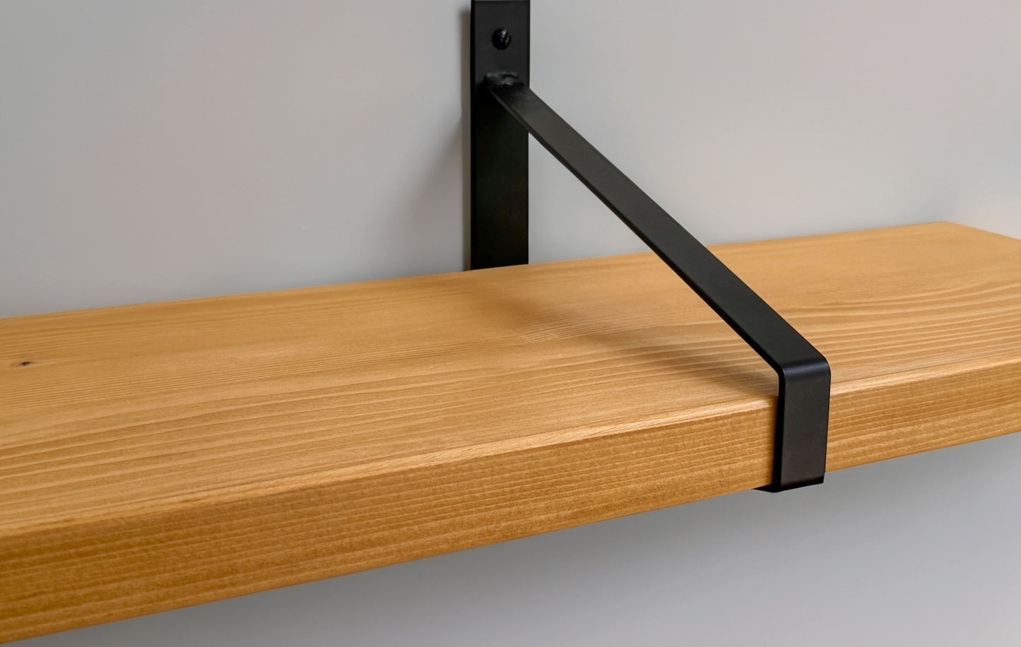 Wooden shelf on suspense bracket with Fiddes colour range
