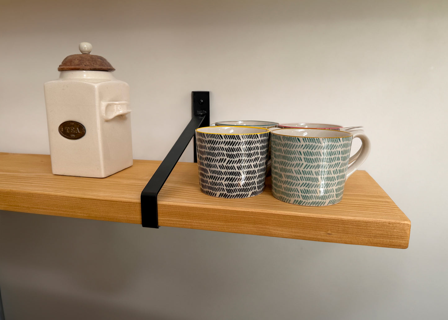 Wooden shelf on suspense bracket with Fiddes colour range