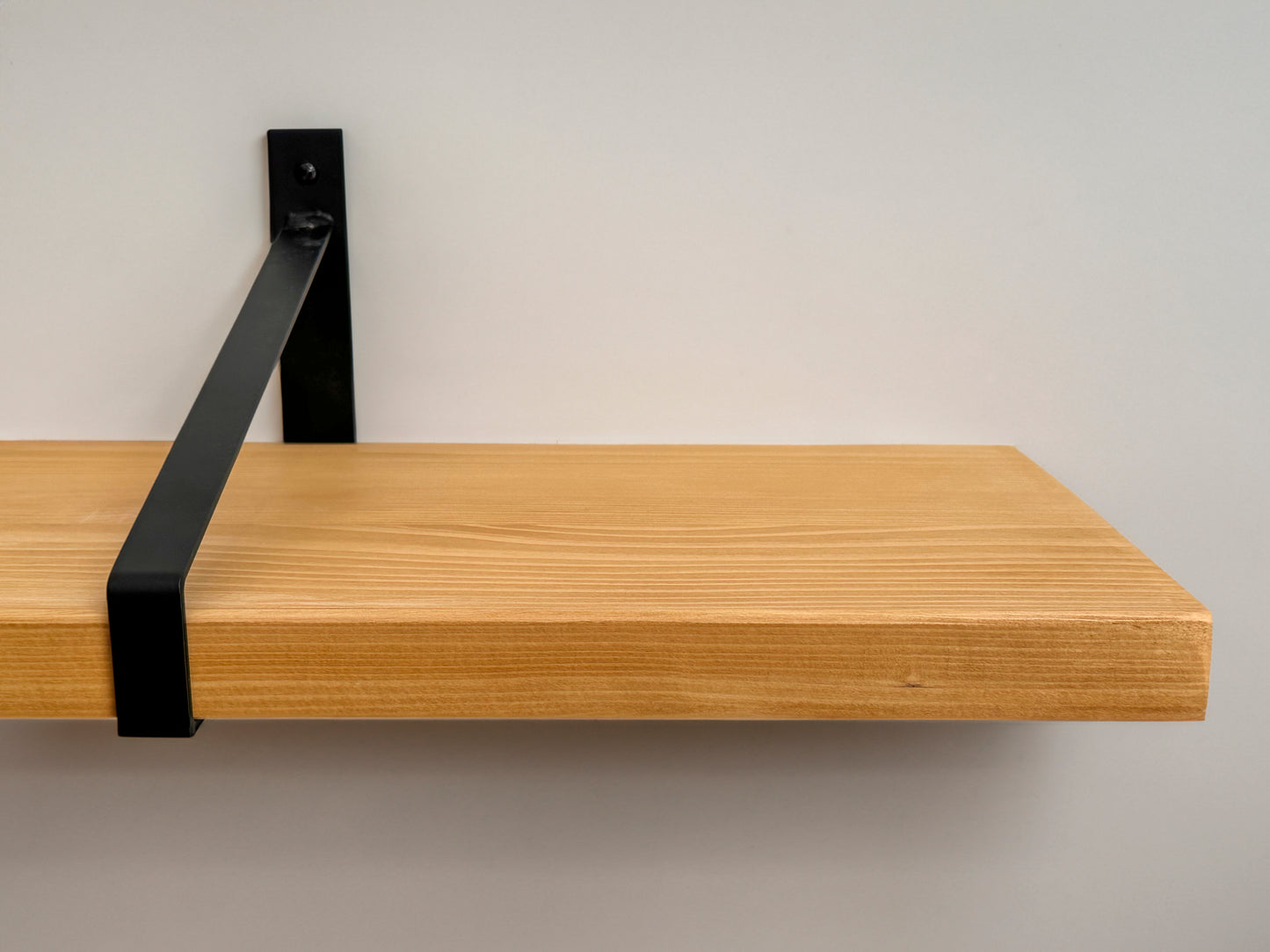 Wooden shelf on suspense bracket with Fiddes colour range