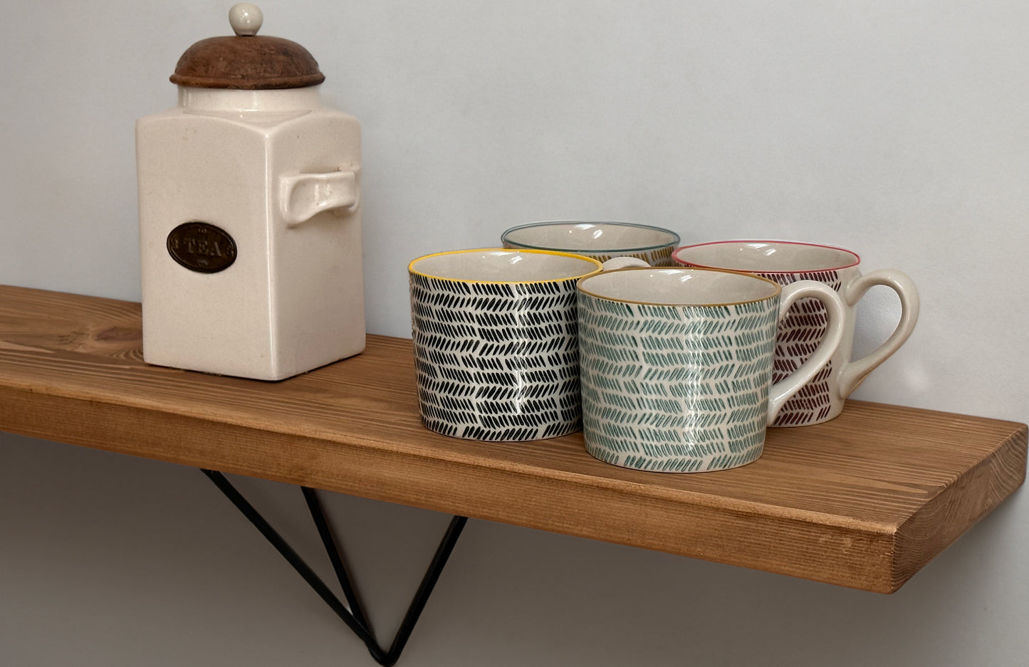 Wooden shelf on prism bracket with Fiddes colour range