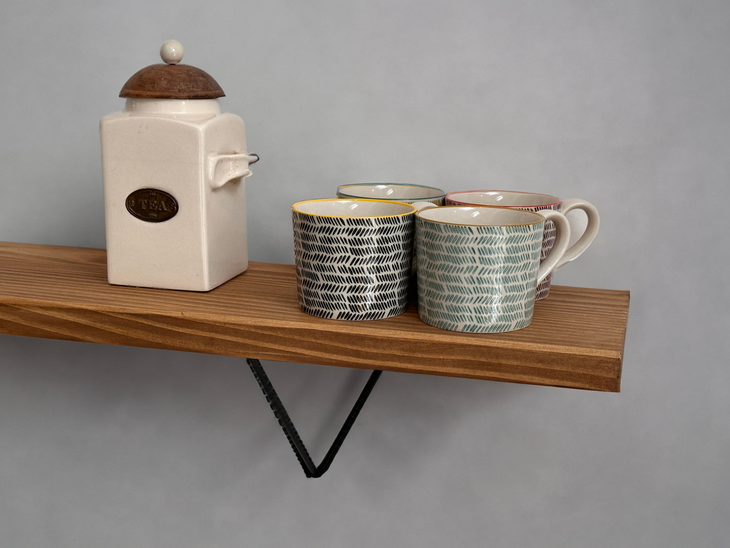 Wooden shelf on prism bracket with Fiddes colour range