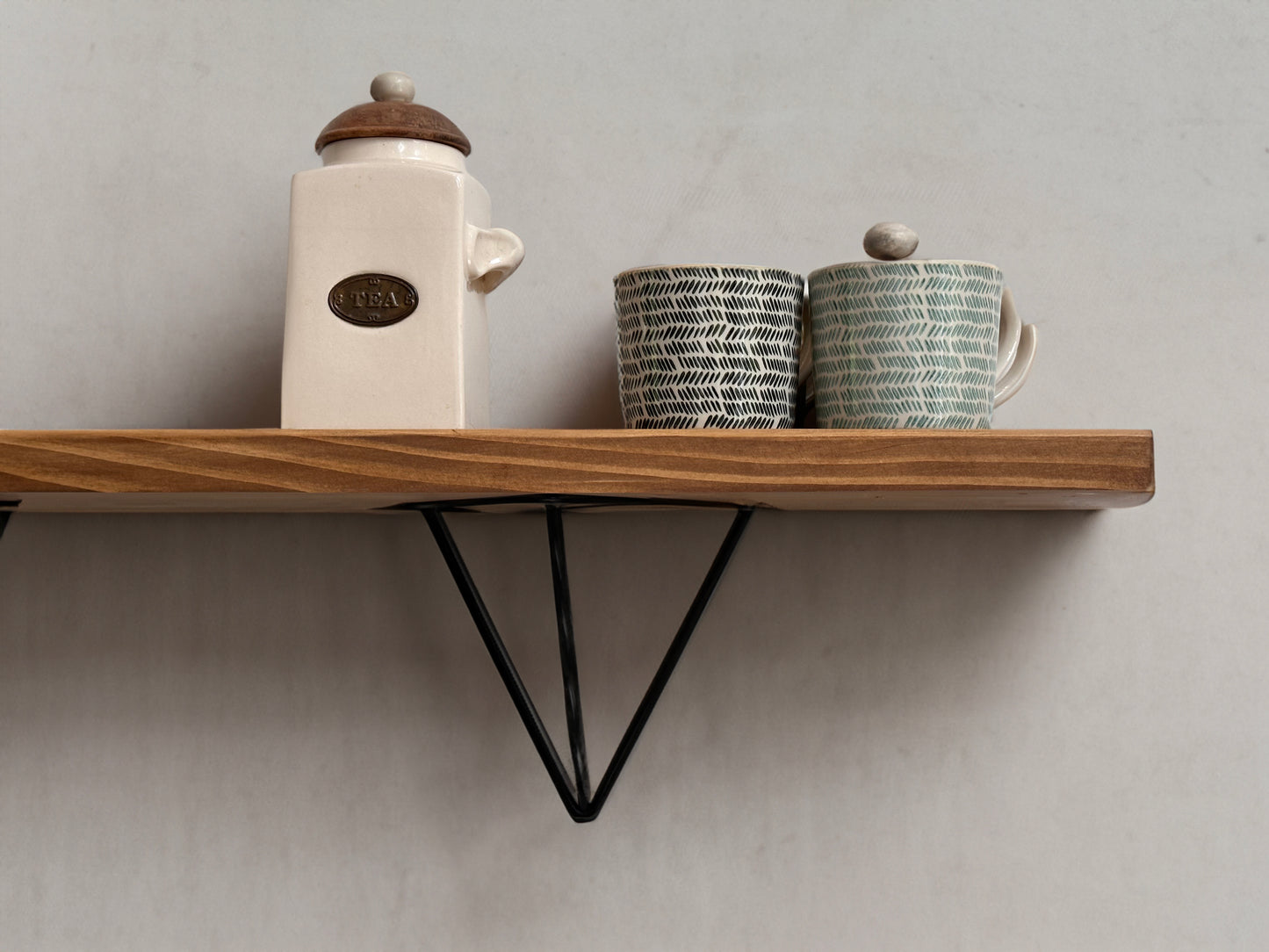 Wooden shelf on prism bracket with Fiddes colour range